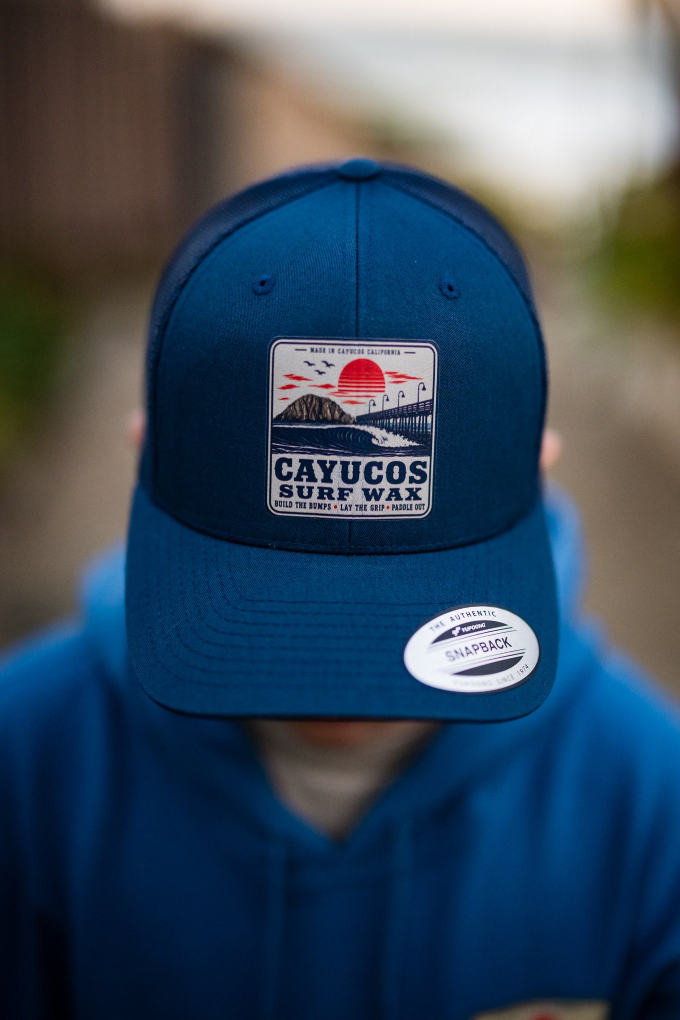 Navy Cayucos Surf Wax Classic trucker hat with embroidered logo