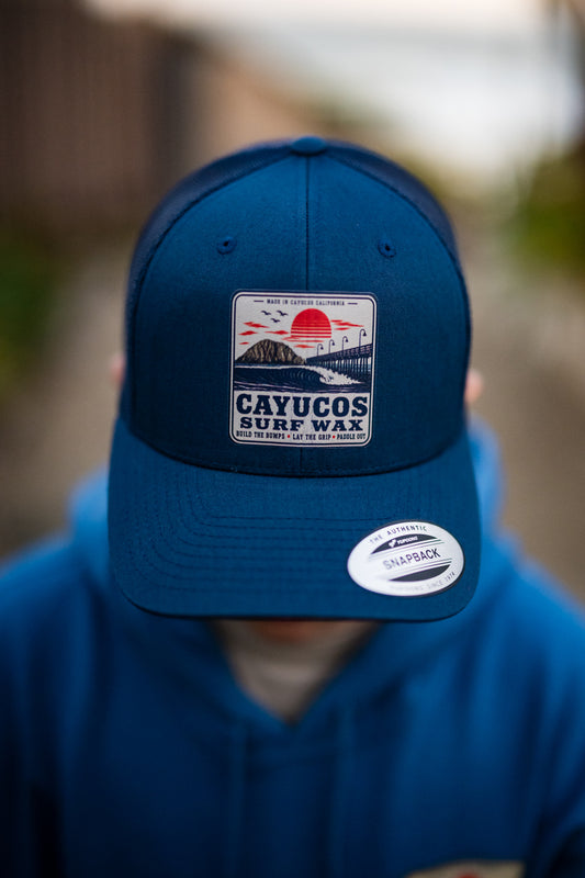 Navy Cayucos Surf Wax Classic trucker hat with embroidered logo