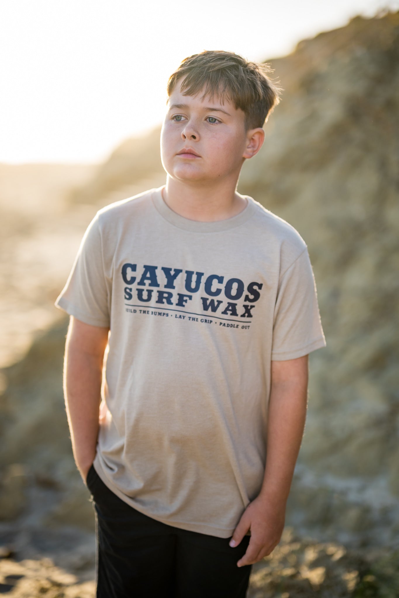 Kids cream Cayucos Surf Wax Heritage T-shirt with navy logo.