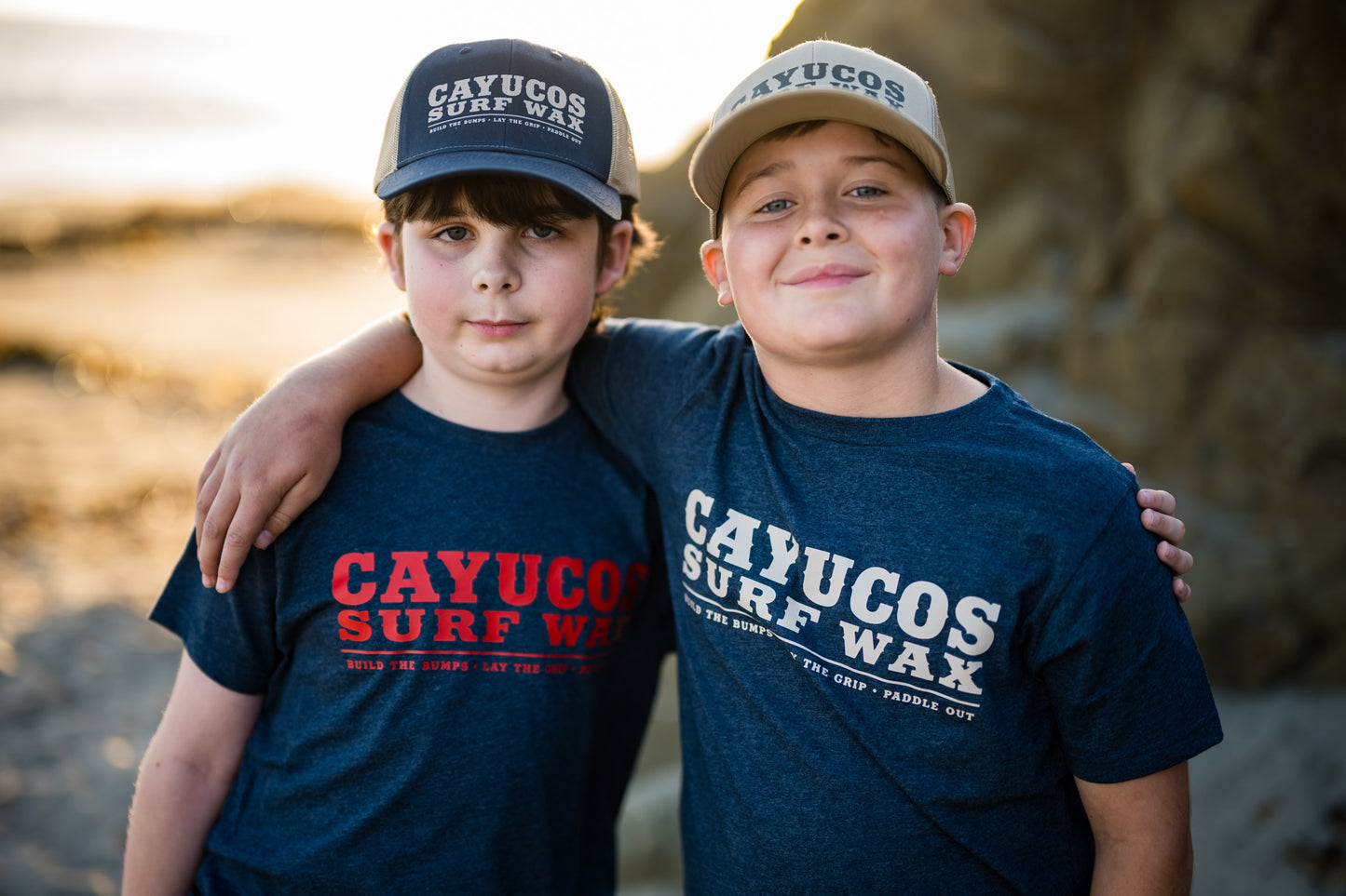 Kids blue Cayucos Surf Wax Heritage T-shirt with orange logo