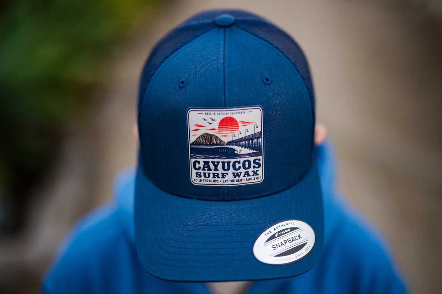 Navy Cayucos Surf Wax Classic trucker hat with embroidered logo