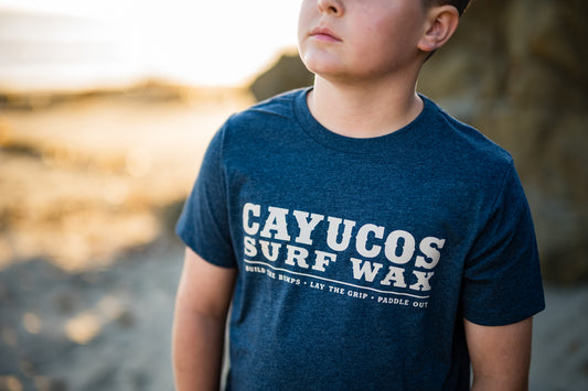 Kids blue Cayucos Surf Wax Heritage T-shirt with vintage tan logo