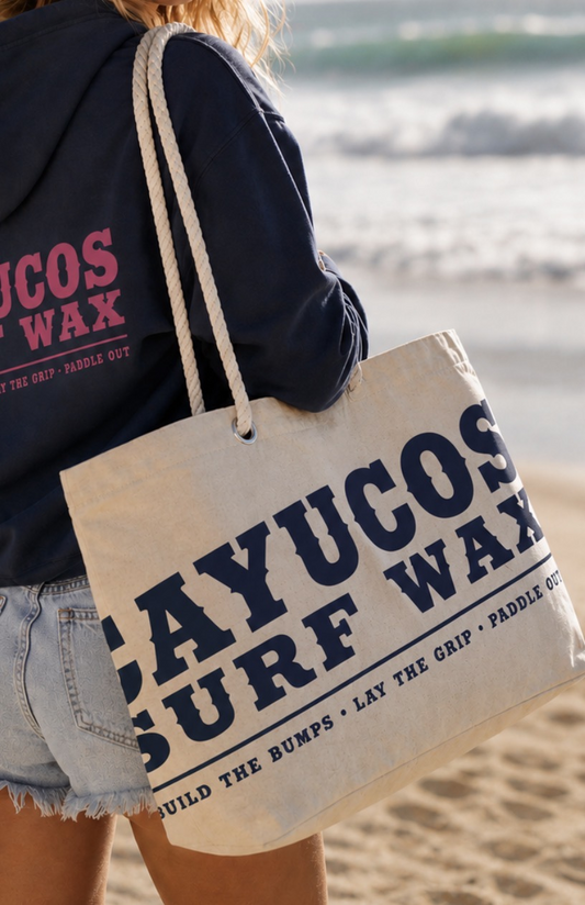 Cayucos Surf Wax Heritage Beach Tote in natural cotton canvas with oversized navy logo and rope handles