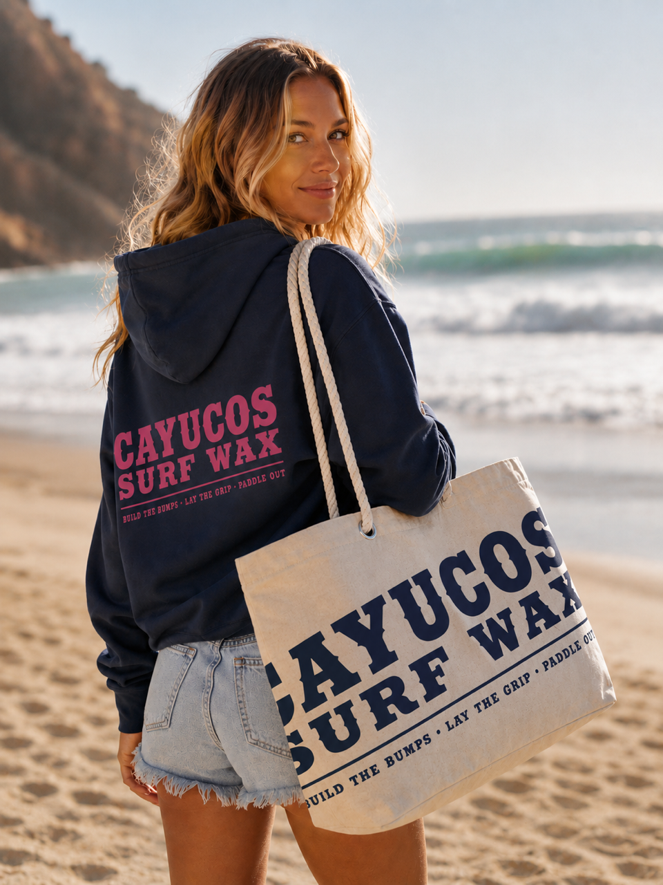 Cayucos Surf Wax navy Heritage Beach Tote on the beach carrying coastal essentials